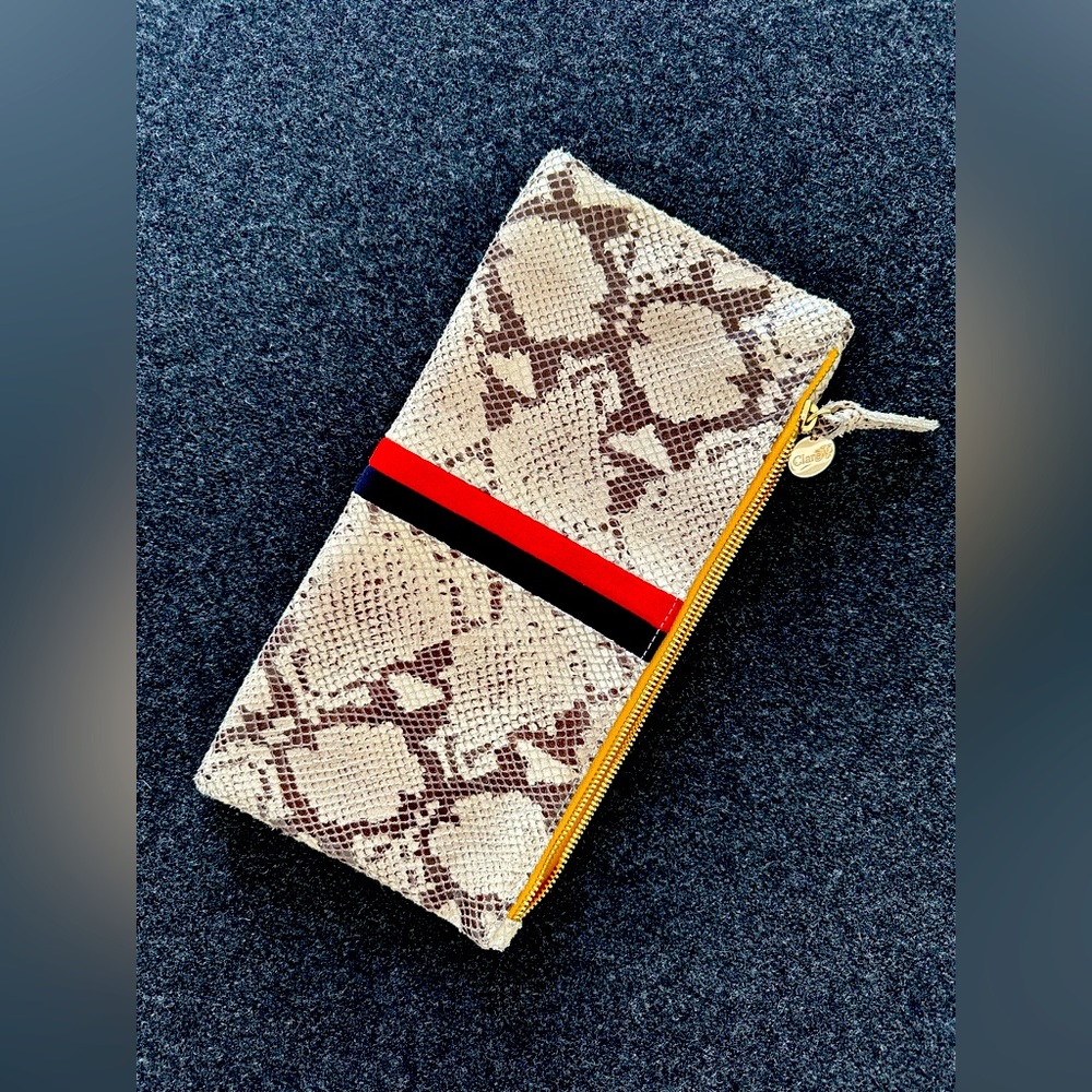 Like new, CLARE V. fold over leather clutch.